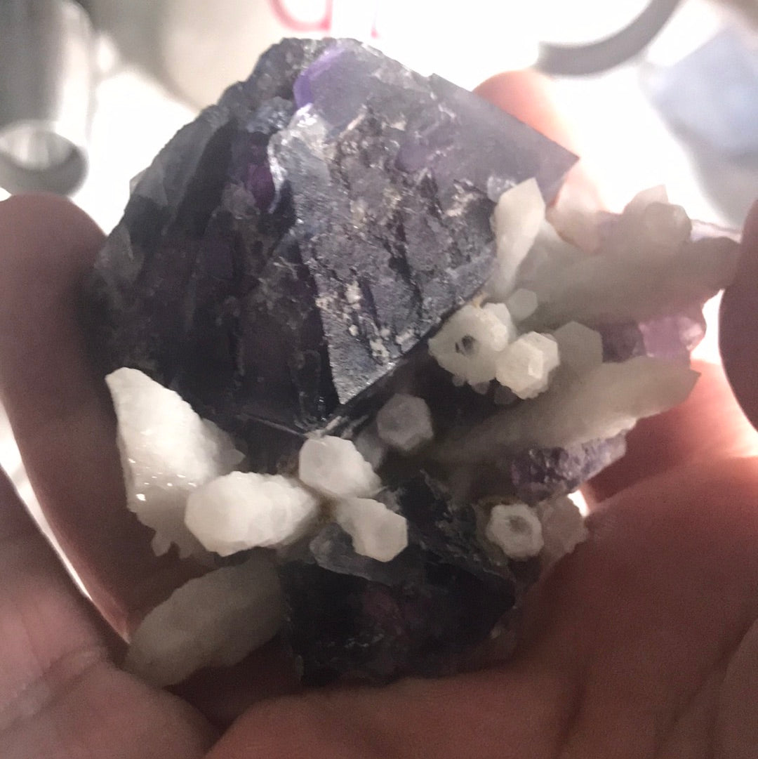Phantom fluorite with candle quartz vees