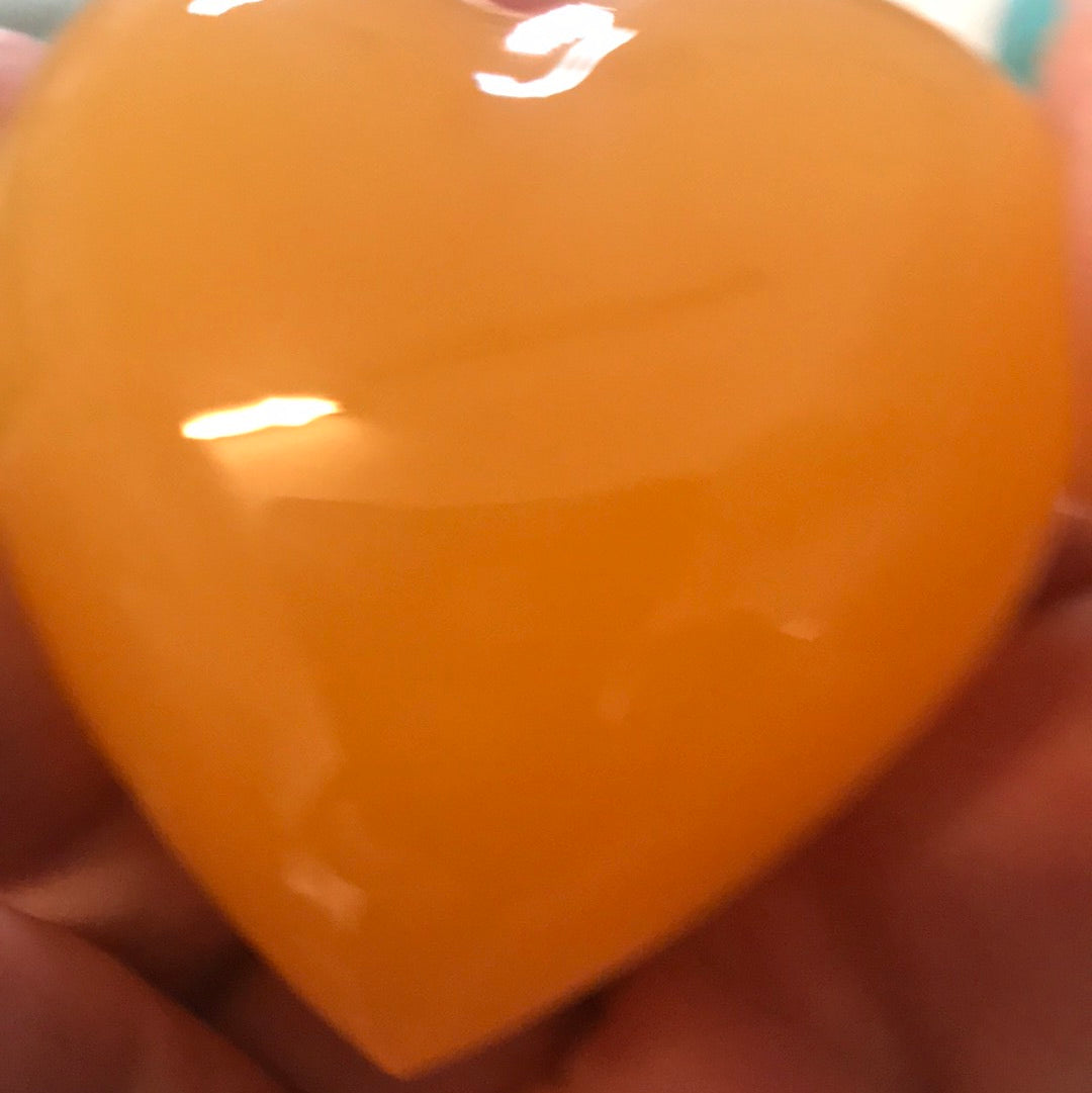 Orange calcite heart manifest