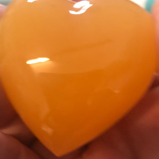 Orange calcite heart manifest